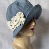 sky blue cotton canvas cloche hat with 3 white fabric pansy flowers.